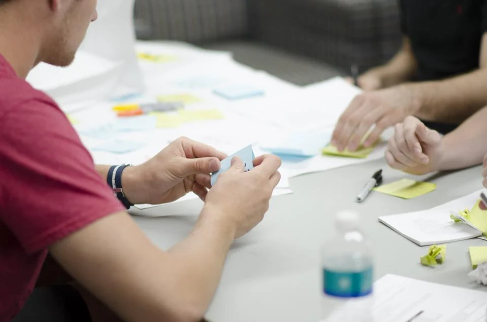 Digital marketing team planning a campaign around a table