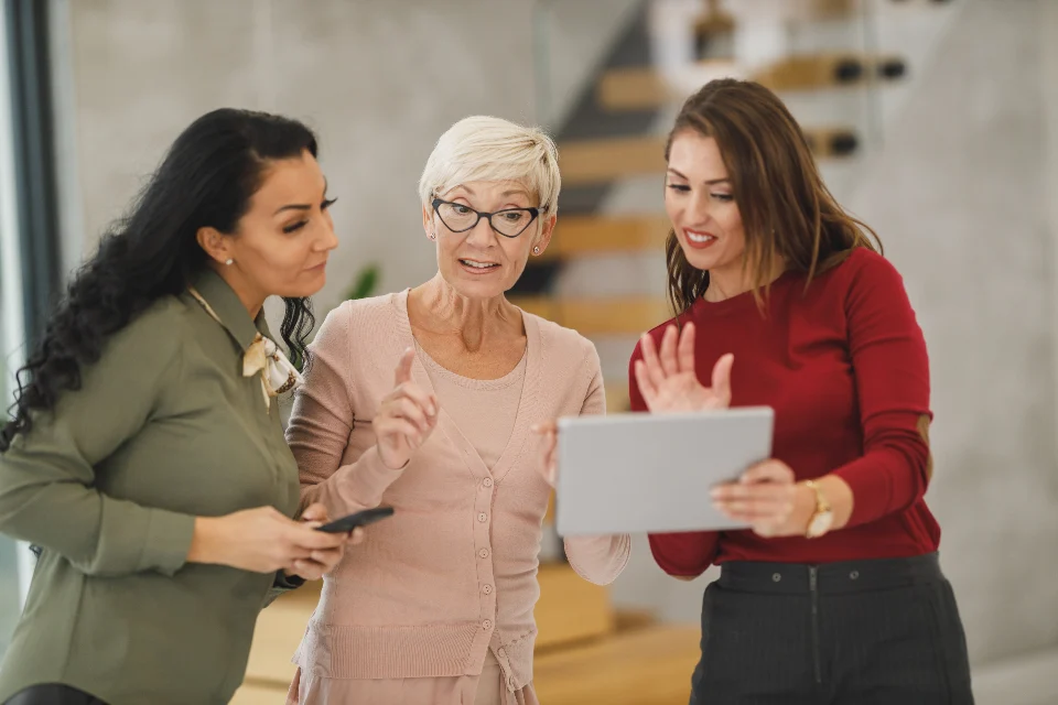 Marketing team discussing ideas together in a bright office