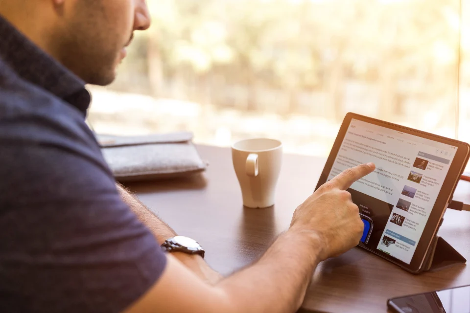 Person reading digital marketing insights on a tablet